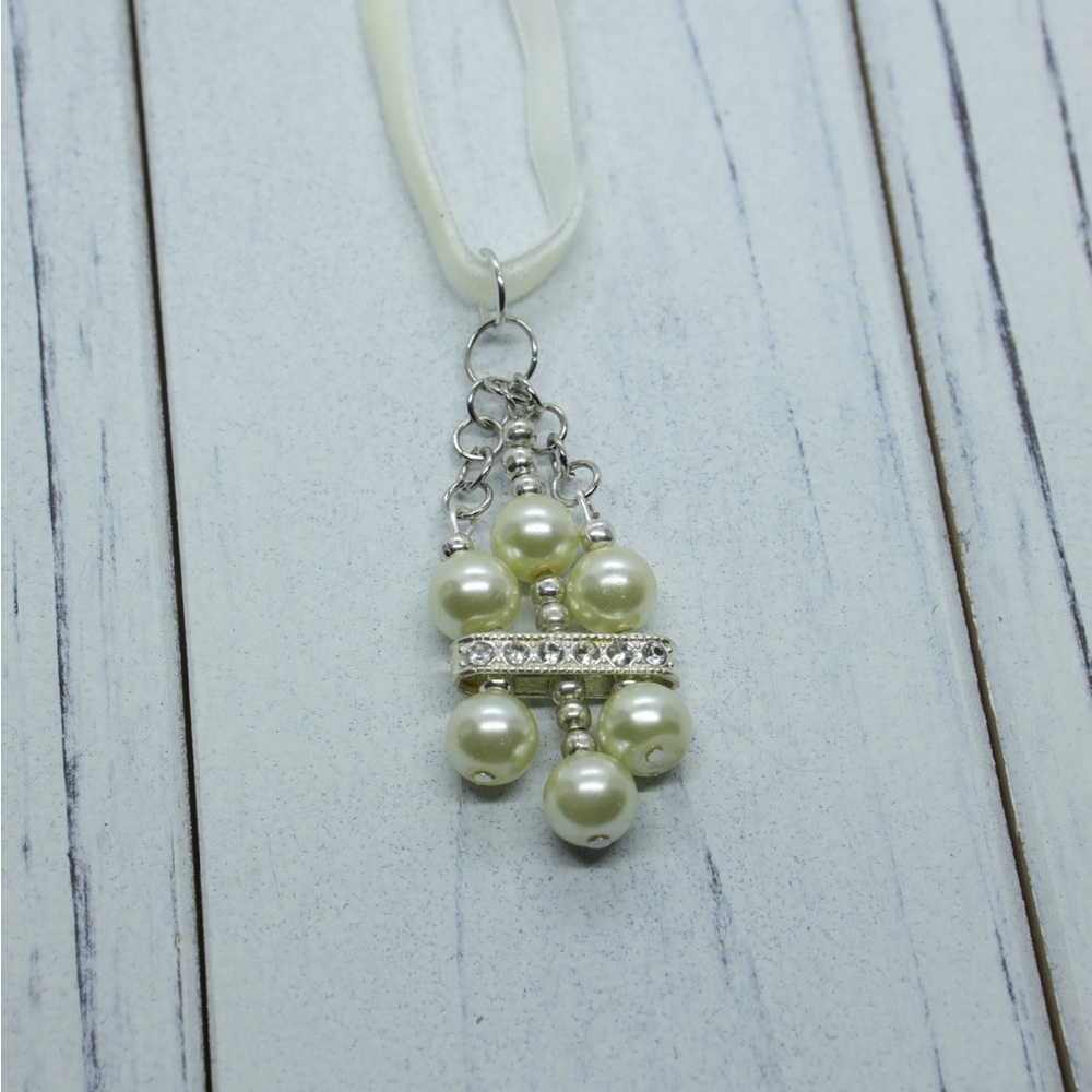 Handmade, Tudor inspired pendant on a cream coloured velvet ribbon necklace.